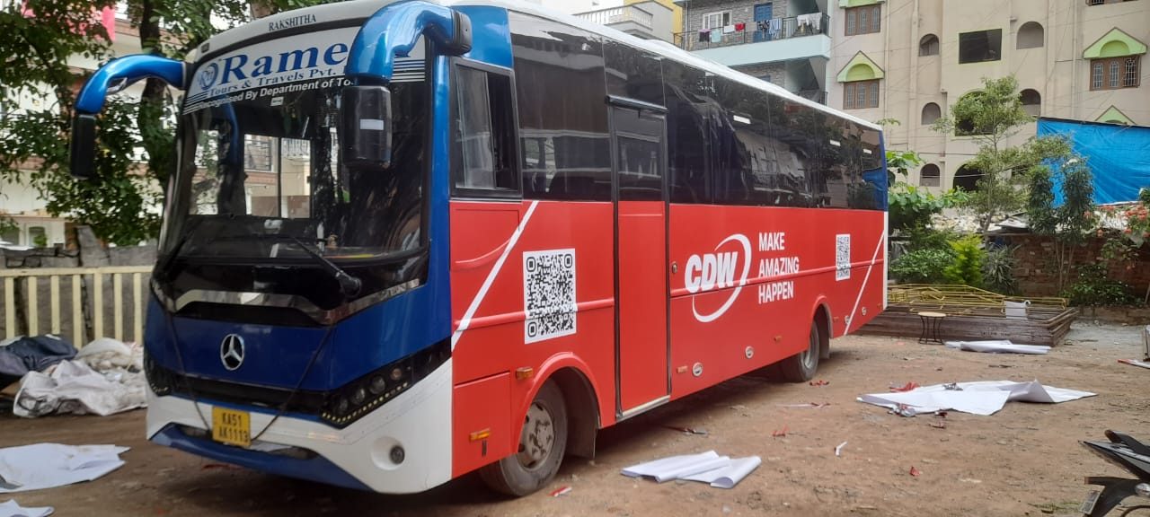 Branded coach, front three-quarter view