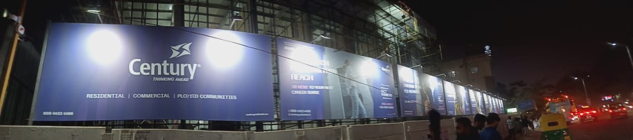 Large-format outdoor hoarding lit at night